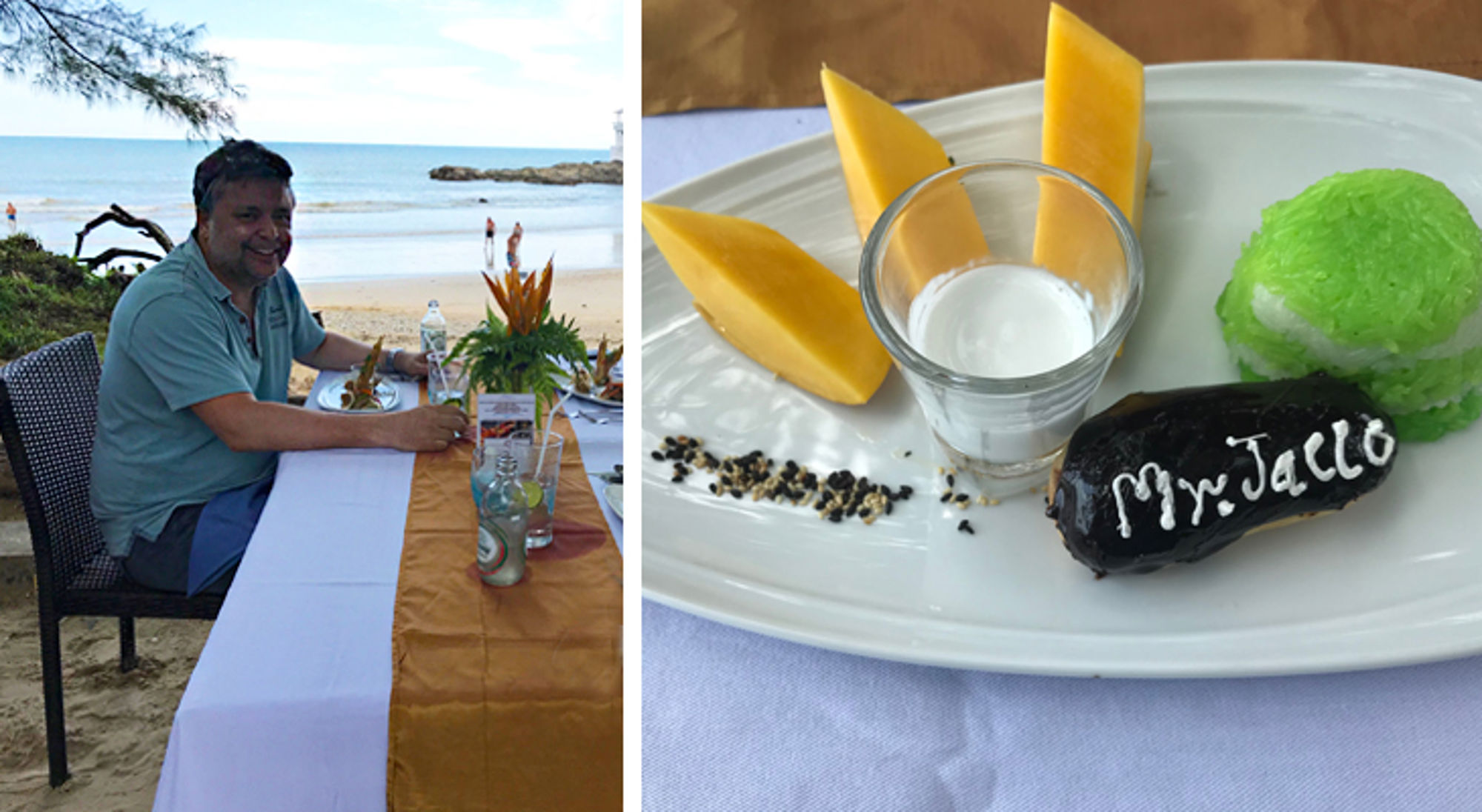 Diner op het strand met uitzicht op zee en dessert met mango, kokosmelk en kleefrijst op bord.