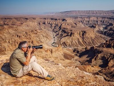 Fotograaf bij Fish River Canyon in Namibië tijdens Route 1 Kaapstad - Victoria Falls.